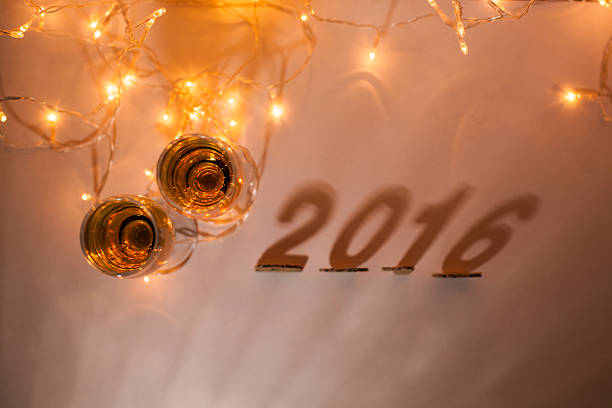 New Year's Eve, 2016, lights,  figures made of cardboard, shadows and glasses of champagne