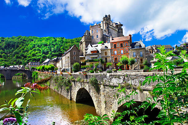 most beautiful villages of France - Estaing Impressive Estaing,France monastery religion spirituality river stock pictures, royalty-free photos & images