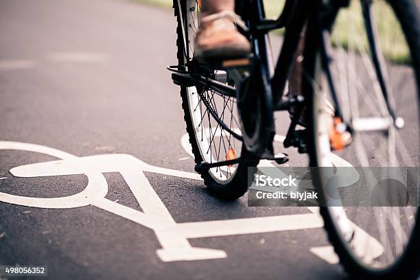 City Bicycle Riding On Bike Path Stock Photo - Download Image Now - Cycling, Bicycle, City