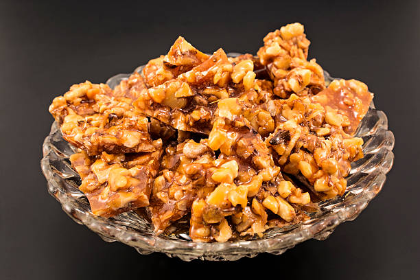istock Homemade candies with walnuts in a glass bowl 498059706