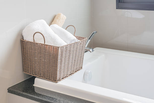 istock white towel in basket on bath tub 498060794