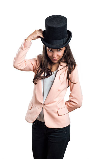 istock Girl holding hat with one hand isolated on white background 498060890