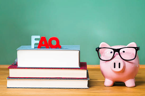 istock FAQ theme with pink piggy bank with chalkboard 498062162