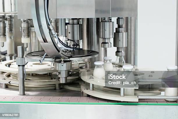 Glass Bottles On The Conveyor Belt Stock Photo - Download Image Now - Food Processing Plant, Milk, Industry