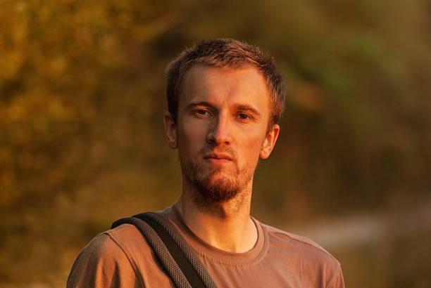 istock handsome young man relaxing outdoor 498063202