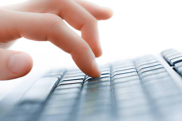 istock Close-up of typing female hands on keyboard 498064371