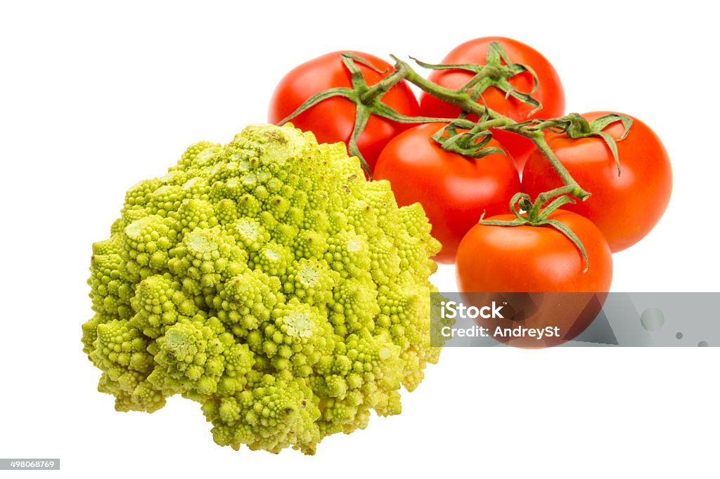 Romanesco cabbage Romanesco cabbage and ripe fresh tomatoes on the branch Agriculture Stock Photo