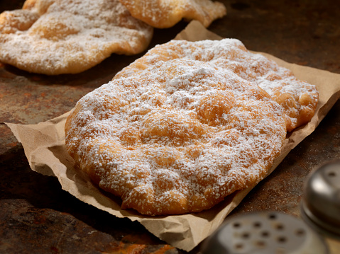 Fried Bread Dough with Cinnamon and Powdered Sugar also known as: fry dough, fry bread, fried bread, doughboys, elephant ears, scones, frying saucers and Dough gods-Photographed on Hasselblad H3D2-39mb Camera