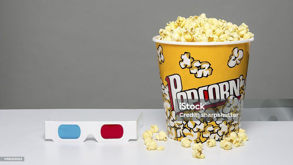 Popcorn and 3d glasses image of a bucket of popcorn and 3d glasses Popcorn Stock Photo