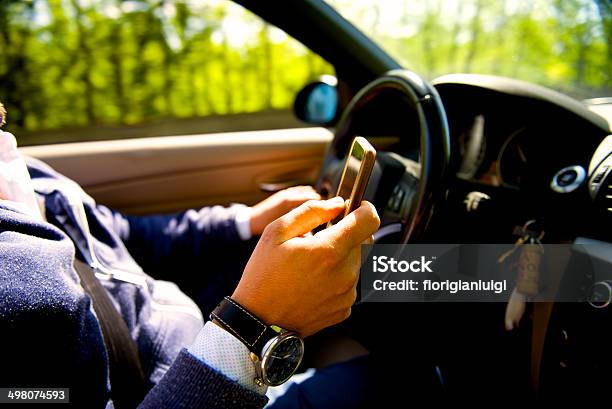 Man Driving A Car And Texting On The Phone Stock Photo - Download Image Now - Adult, Adults Only, Car