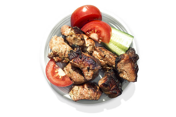istock Roasted meat with vegetables on a plate. 498074681