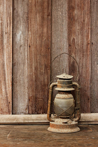 istock Old lantern on wooden background 498076927