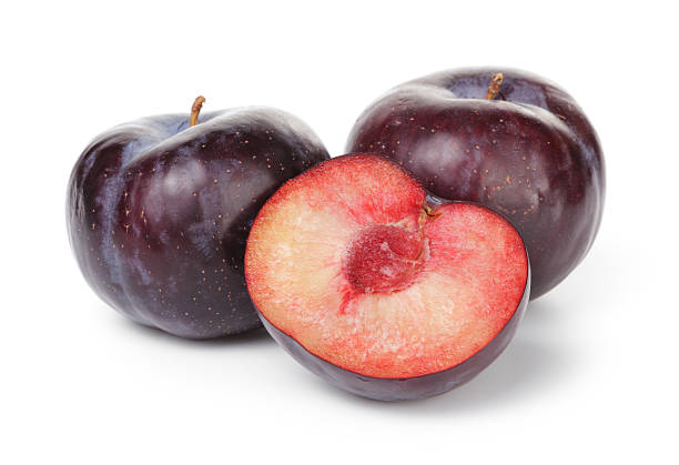 black plums with half black plums with half, isolated on white background plum red white purple stock pictures, royalty-free photos & images