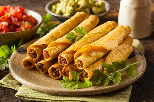 Homemade Mexican Beef Taquitos with Cilantro and Salsa