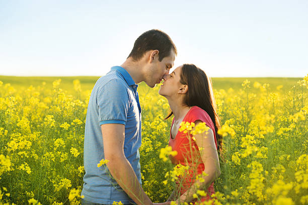 istock Couple in love in field 498086799