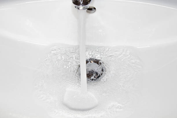 istock Water flowing from the sink crane 498087427