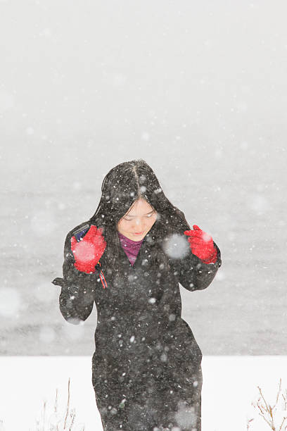 istock Woman Running Through Snowstorm 498087473