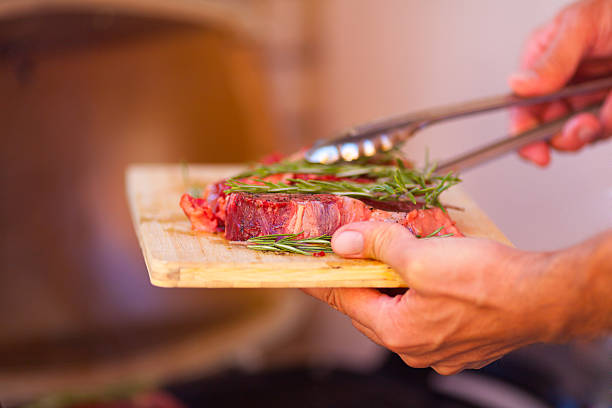 istock Closeup of steak fresh meat preparing on grill 498087755