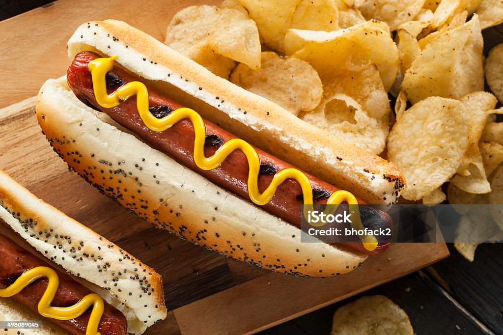 Gourmet Grilled All Beef Hots Dogs Gourmet Grilled All Beef Hots Dogs with Sides and Chips American Culture Stock Photo