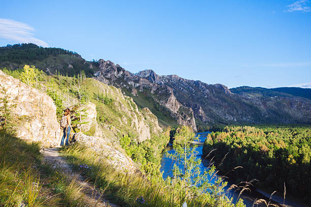 young beautiful woman trekking  in  mountains.