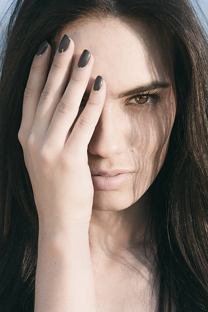 istock Pretty Woman Covering Half Face with Hand 498090666