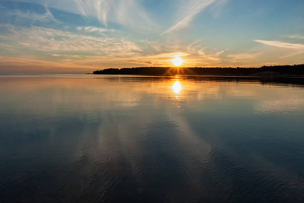 istock Lake with Sun and evening glow reflecting in calm water 498091491