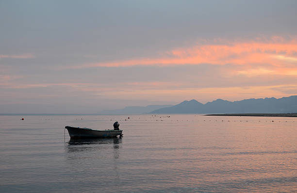 istock Evening. Lonely boat at sea 498091497