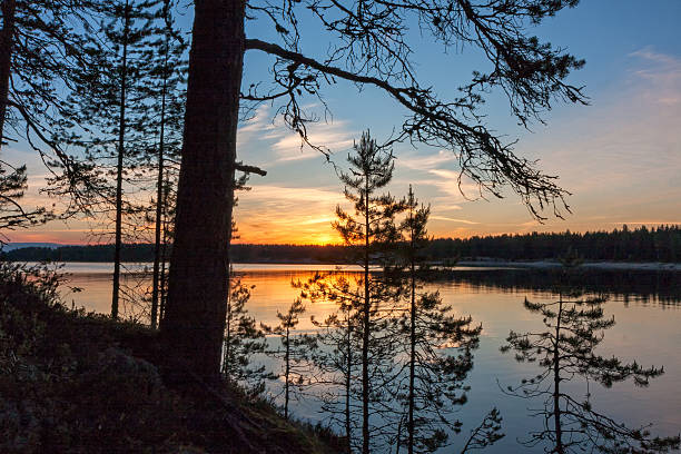 istock Lake with Sun and evening glow reflecting in calm water 498091525