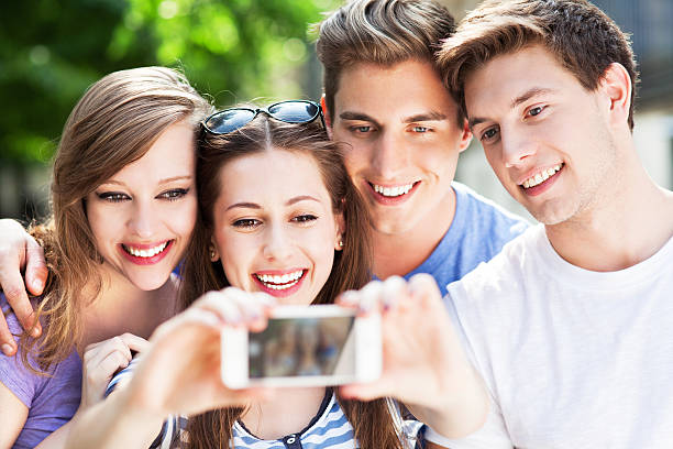 istock Friends taking photo of themselves 498092235