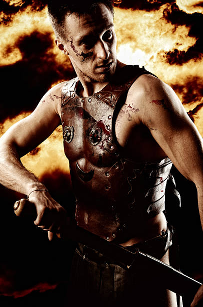 istock Armed ancient rome warrior with taking out sword in battle 498092593