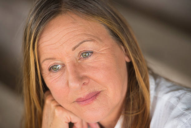 istock Thoughtful sad mature woman portrait 498097034