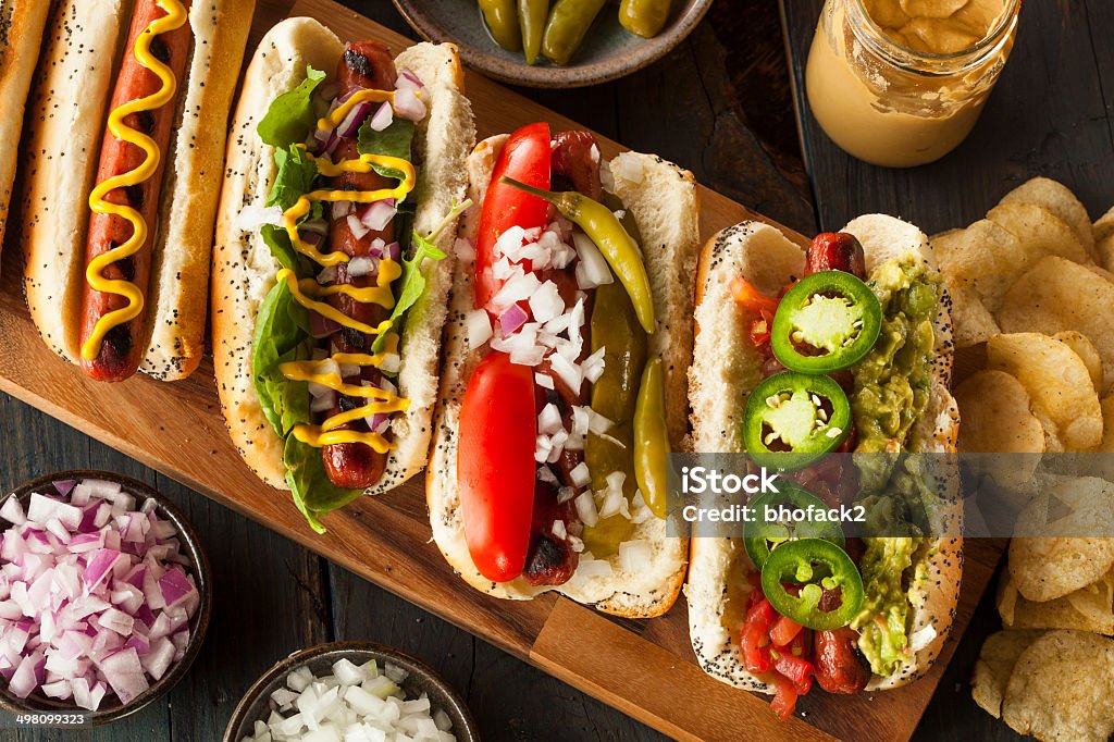 Gourmet Grilled All Beef Hots Dogs Gourmet Grilled All Beef Hots Dogs with Sides and Chips Hot Dog Stock Photo