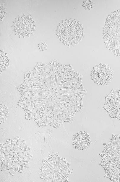 istock crocheted doilies in gesso on a wall 498099443