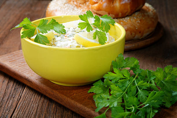 istock plate with salad and bread rolls at the village table 498099720