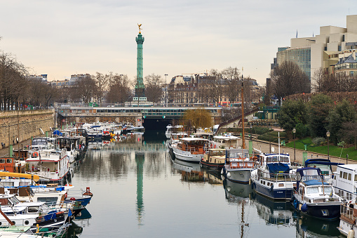 View of the harbor and monument at La Bastille in Paris, France