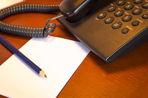 istock Blank white paper on the wooden  desk 498101689