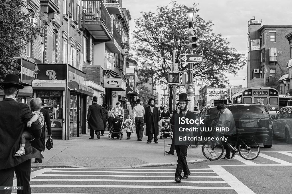Jewish hassidic on the street. New York, USA - September 22, 2015: Jewish hassidic men cross the street. New York City Stock Photo