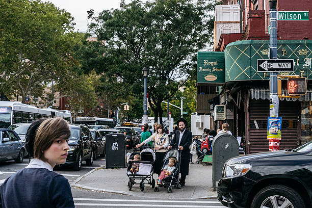 New York, USA - September 22, 2015: Jewish hassidic pair cross the street.