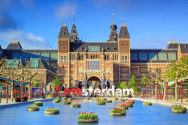 Vibrant tulips museum Amsterdam Amsterdam, The Netherlands - May 2, 2014: Beautiful vibrant of tulips in the pond in front of the Rijksmuseum (National state museum) in Amsterdam in spring on May 2, 2014 amsterdam stock pictures, royalty-free photos & images