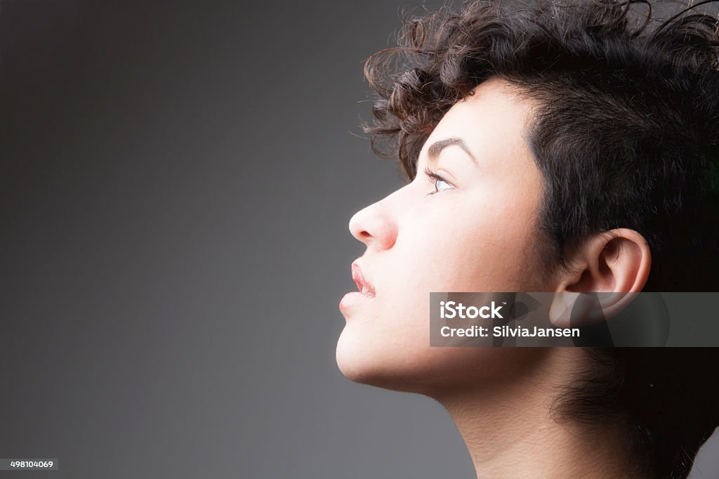 young woman profile hope profile of a young woman looking up 18-19 Years Stock Photo