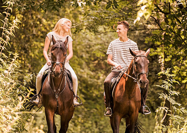 istock Couple horseback riding. 498104153