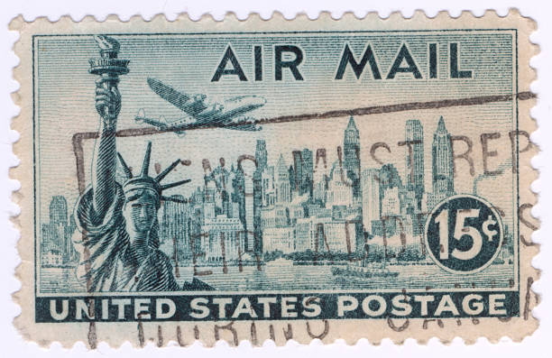 United States Stamps Stamp printed in United States of America shows Statue of Liberty on the background the skyscrapers of New York, airliner Lockheed Constellation, circa 1947 grover cleveland stock pictures, royalty-free photos & images