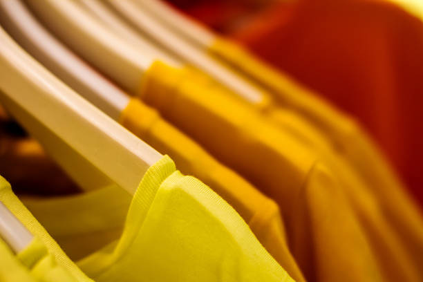 istock yellow blouse on a hanger in the closet hanging 498105249