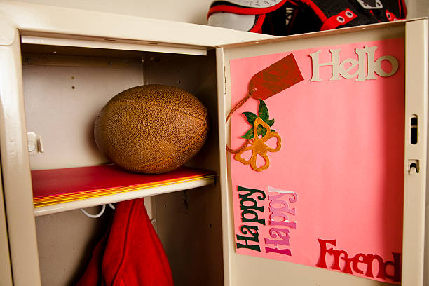 istock Football, jacket inside a school locker. Notes on door. 498110513