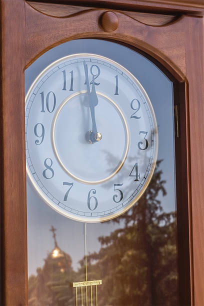 istock Wooden clock in retro style with a reflection 498110695