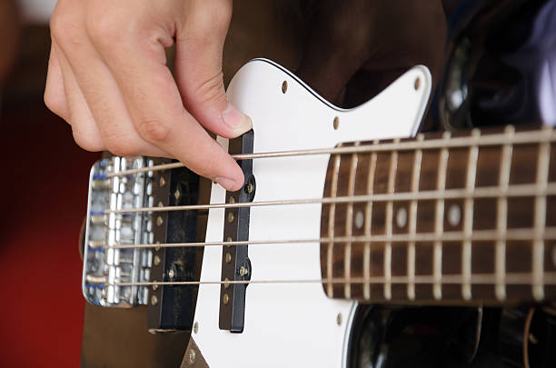istock Hand for bass guitar 498111173