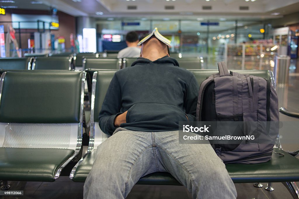 Waiting for a night flight in airport Airport Stock Photo