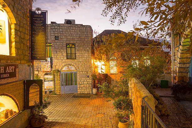 Safed, Israel - November 17, 2015: Sunset scene in an ally in the Jewish quarter, with local businesses, in Safed (Tzfat), Israel