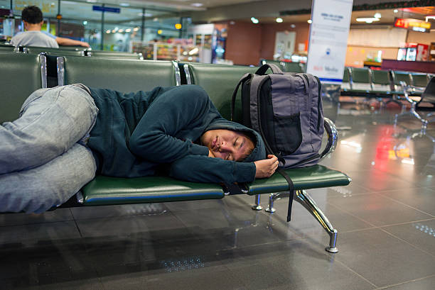 istock Young hippie man too tired because his flight delay 498112576