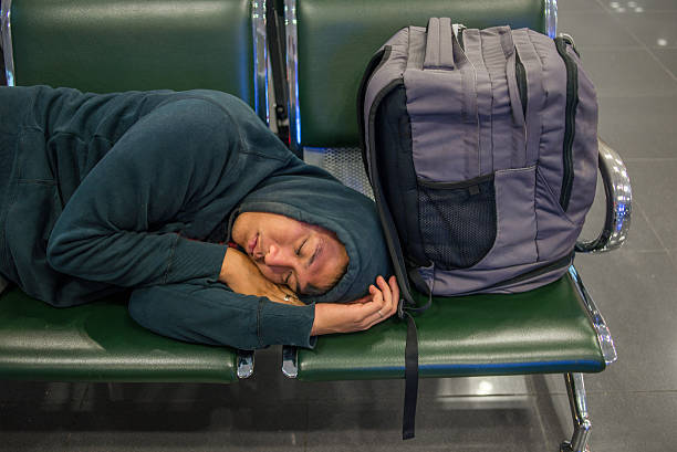 istock Asian hippie sleeping on the bench with his rucksack beside 498112678